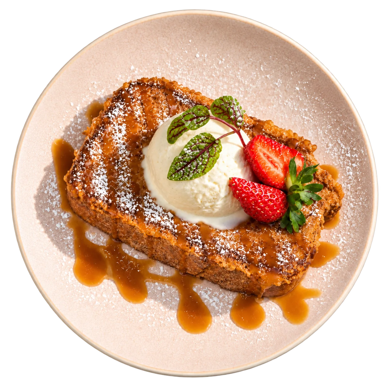 French toast with ice cream, strawberries and caramel sauce, seen from above